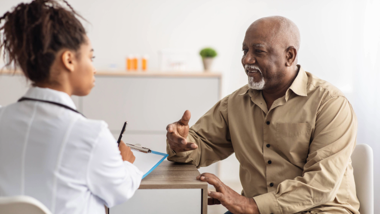 a senior man with a care coordinator